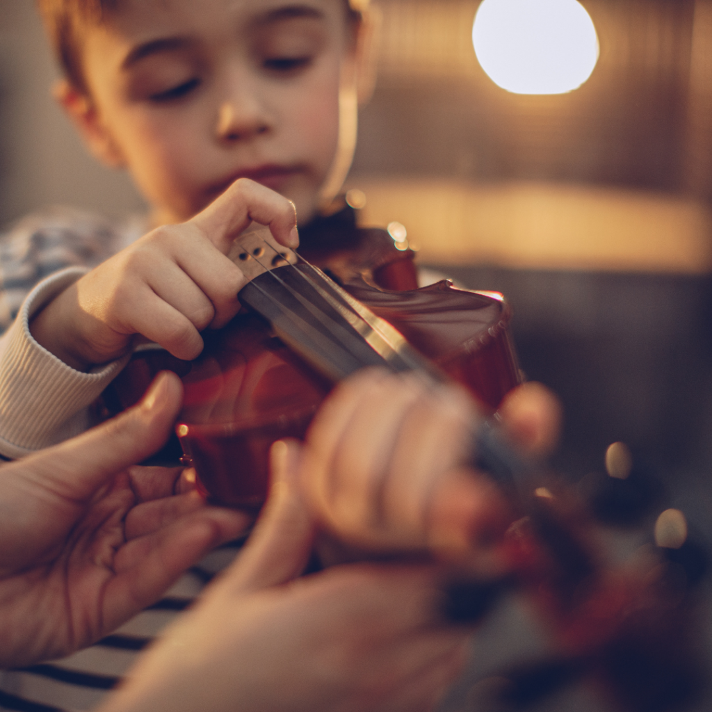 Kid learning violin